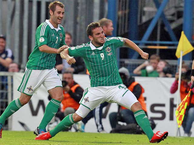 Northern Ireland’s Martin Paterson is congratulated by team-mate Niall McGinn after scoring the winner against Russia