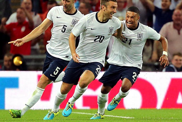 Rickie Lambert (middle) celebrates scoring England’s winner