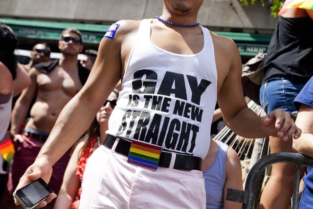 A man wears a shirt that reads 'gay is the new straight' during the New York City Gay Pride March on June 24, 2012 in New York City. The annual civil rights demonstration commemorates the Stonewall riots of 1969, which erupted after a police raid on a gay bar, the Stonewall Inn on Christopher Street.