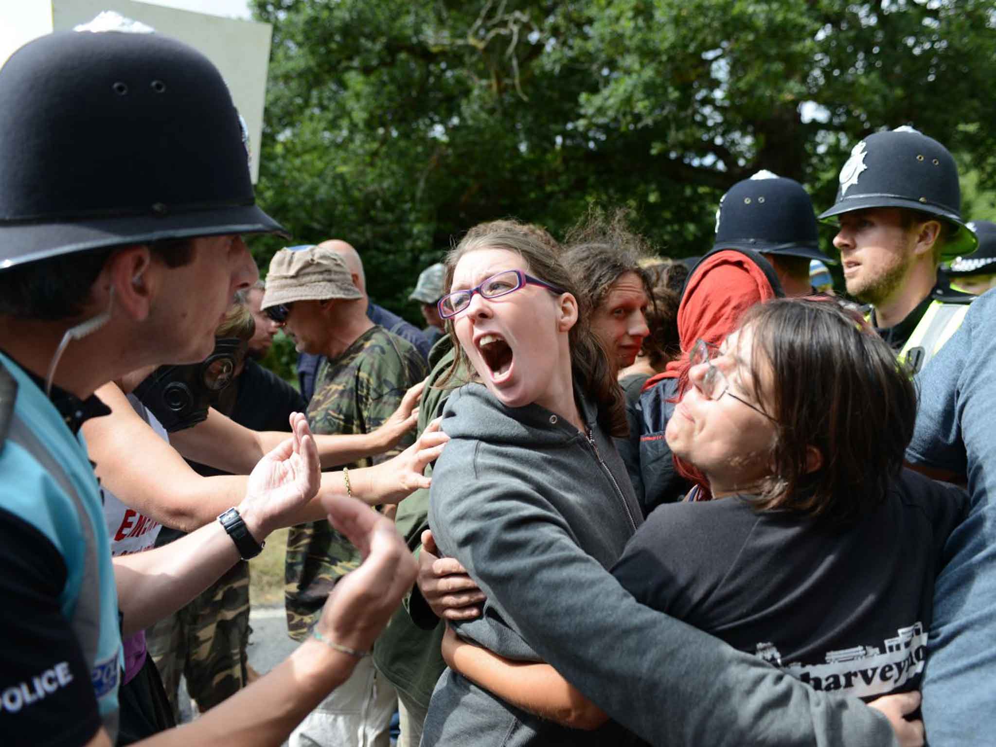 A woman disagrees with a police liaison officer during yesterday’s anti-fracking protest