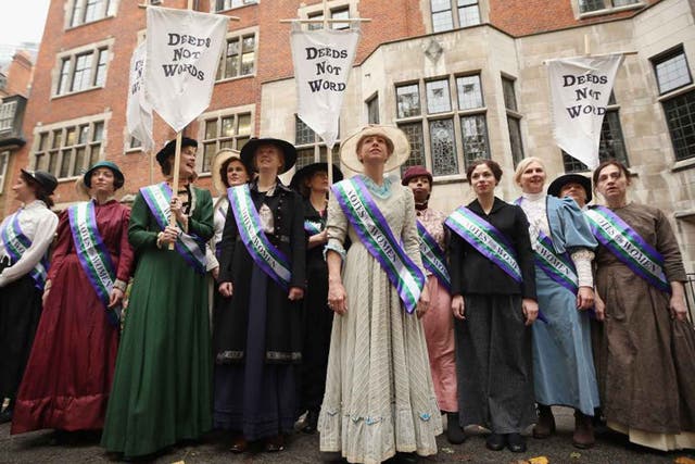 Hear their roar: campaigners dressed as suffragettes attend a rally organised by UK Feminista