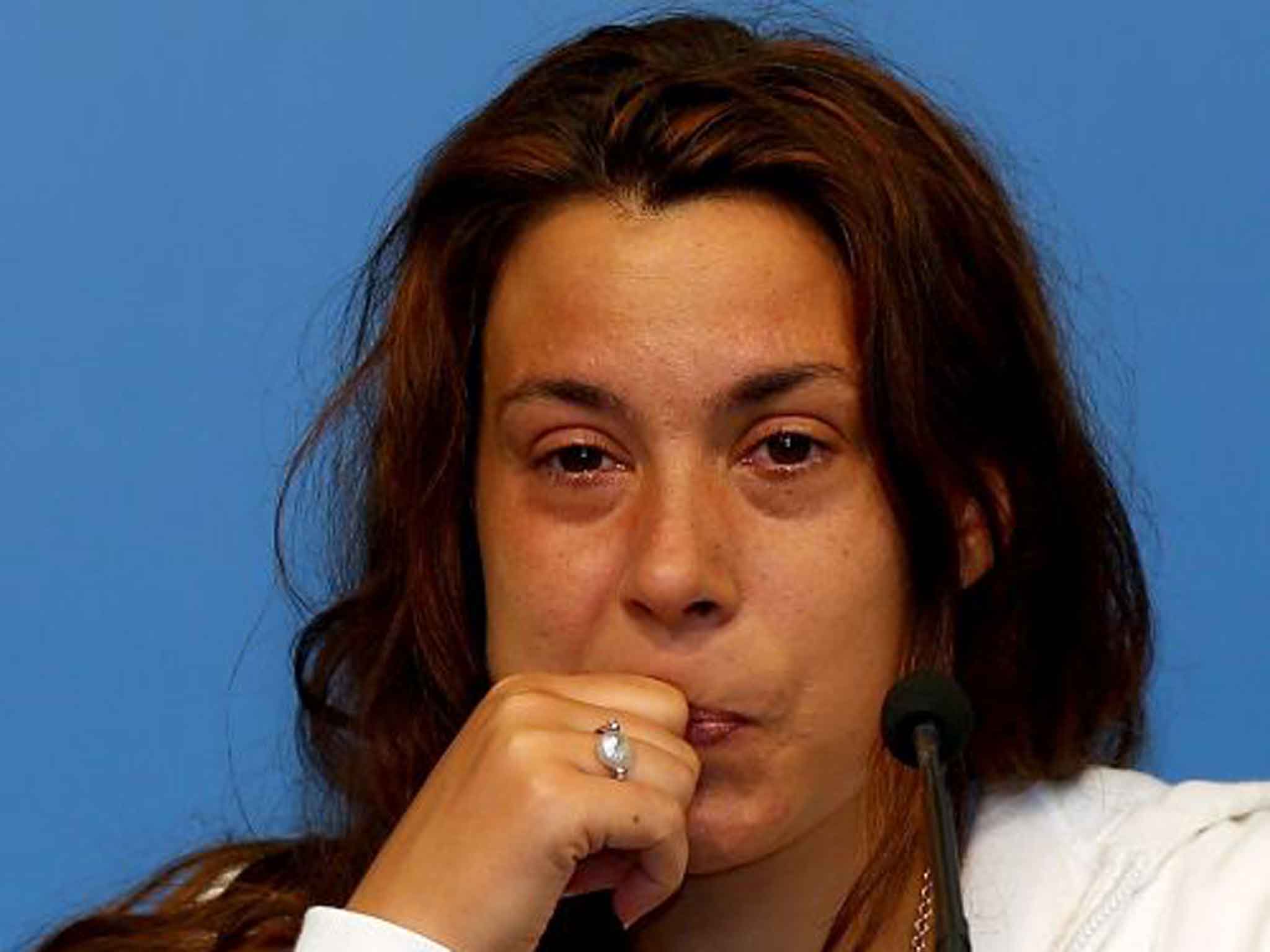 A tearful Marion Bartoli informs the media of her retirement