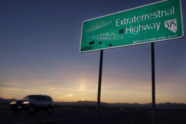 A car moves along the Extraterrestrial Highway near Rachel, Nevada, on the east side of Area 51