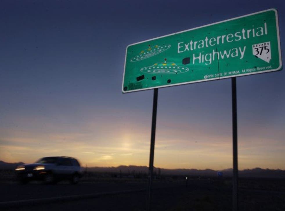 A car moves along the Extraterrestrial Highway near Rachel, Nevada, on the east side of Area 51