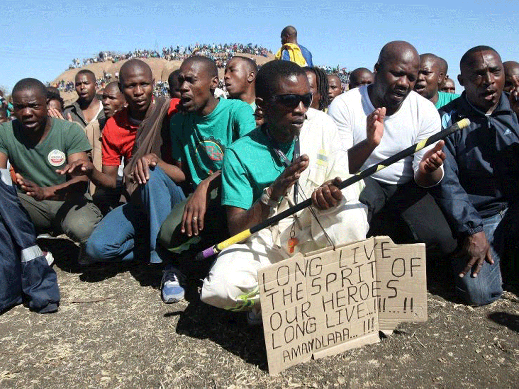 Lonmin Mine workers gather at the hill nearby the Marikana Platinum Mine in Rustenburg, South Africa