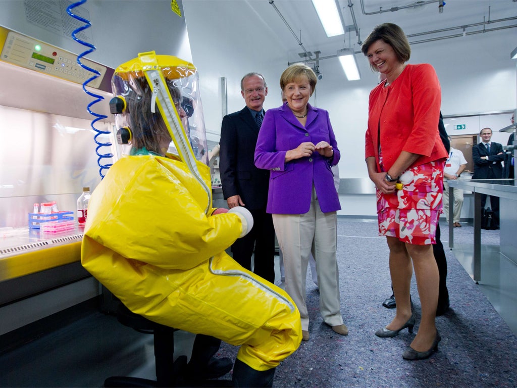 Chancellor Merkel visits a veterinary research facility in Riems