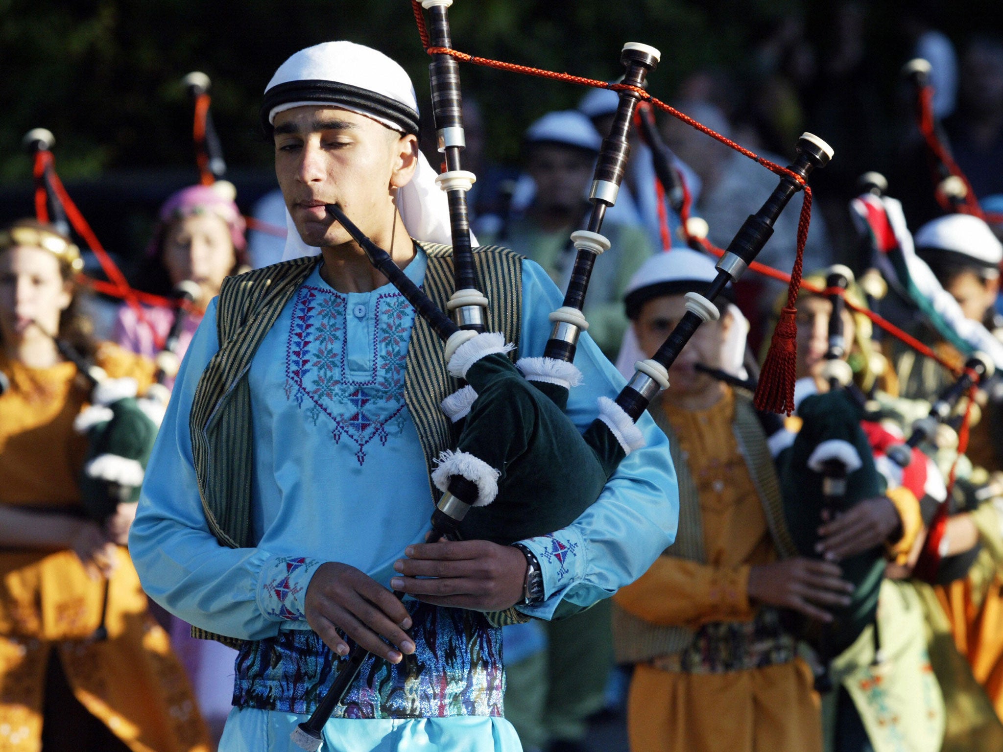 A member of the Palestinian group Guirab plays the Highland pipes