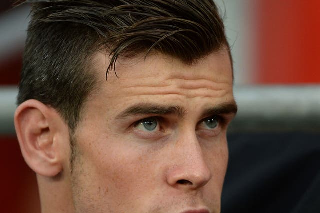 Stuck in the middle: Gareth Bale has become embroiled in a game of brinkmanship between Tottenham and his suitors Real Madrid