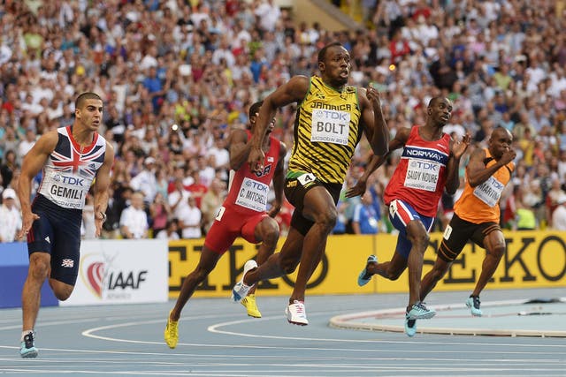 Usain Bolt, centre, leads the field, including Adam Gemili, left, in his 200m victory in Moscow