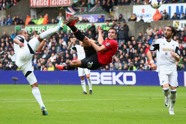 Robin van Persie puts Manchester United ahead with an acrobatic effort in the champions’ win