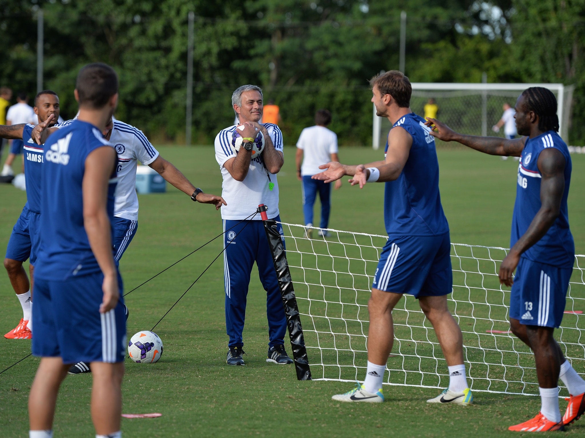 Mourinho enjoys a light moment with Branislav Ivanovic during pre-season training