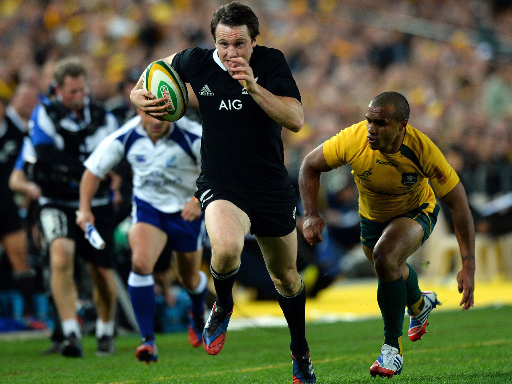 Quick step: Ben Smith evades Australia’s Will Genia before running in one his three tries for New Zealand in their 47-29 win in Sydney