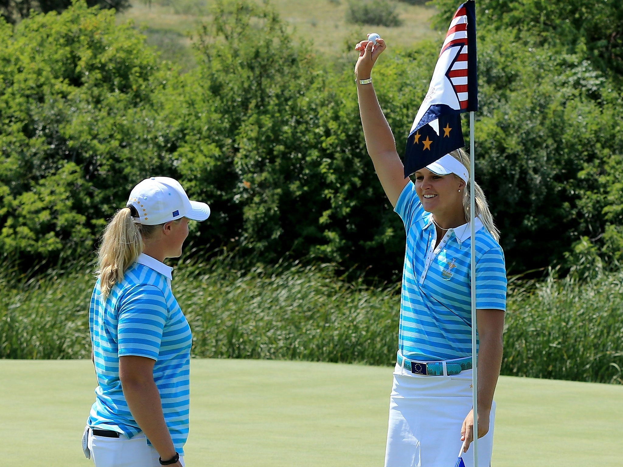 That’s ace: Anna Nordqvist, right, celebrates her hole-in-one with Caroline Hedwall, left