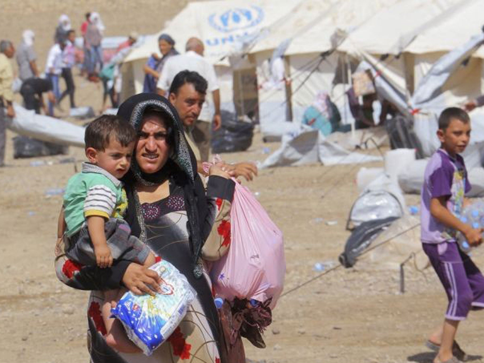 Thousands of Syrian refugees poured into the Kurdistan region of northern Iraq on Thursday, taking advantage of a new bridge along the largely closed border, the United Nations said on Friday
