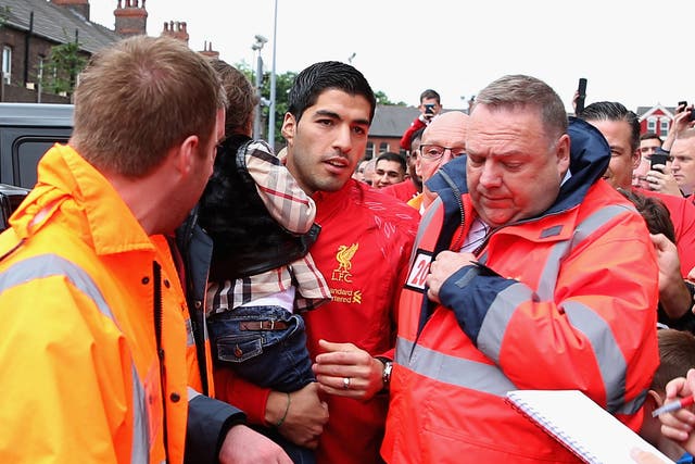 Luis Suarez arrives at Anfield yesterday to watch Liverpool's 1-10 victory over Stoke