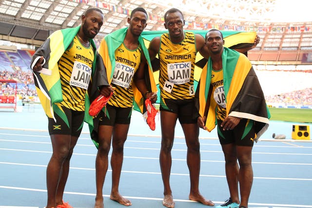 Usain Bolt (second from right), celebrates with Jamaican 4x100m team-mates (left to right) Nickel Ashmeade, Kemar Bailey-Cole, and Nesta Carter 
