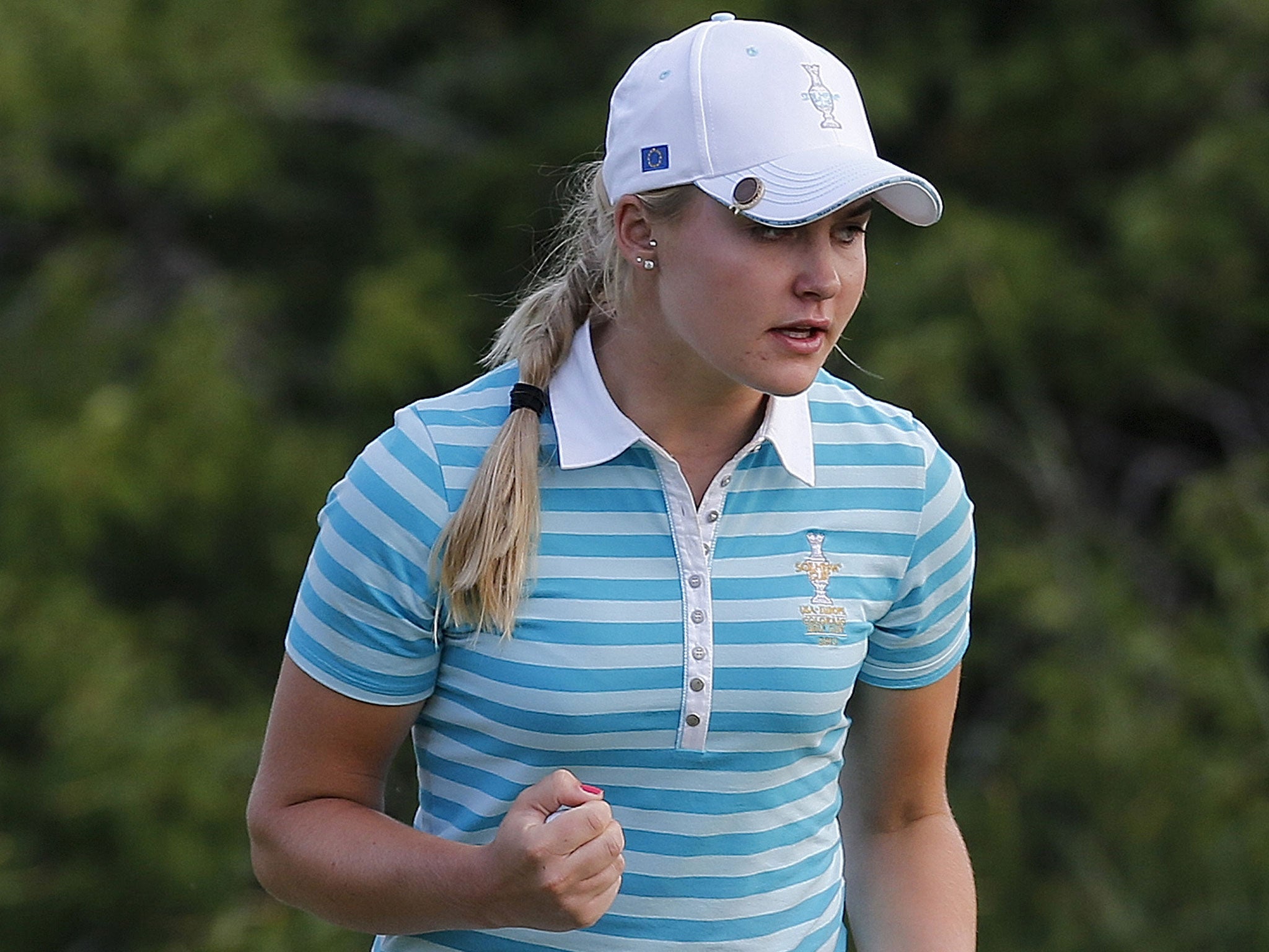 Charley Hull celebrates a birdie during her fourballs victory