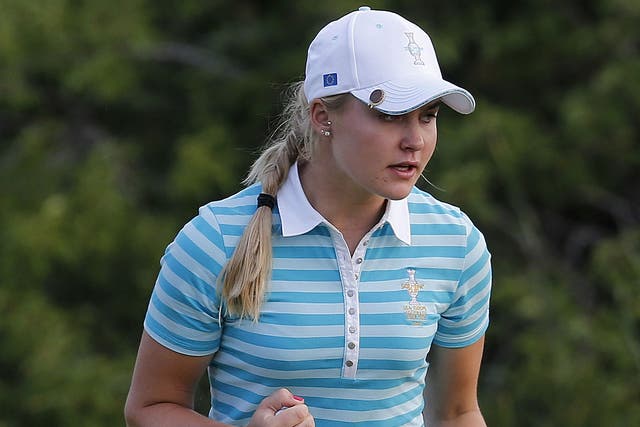 Charley Hull celebrates a birdie during her fourballs victory