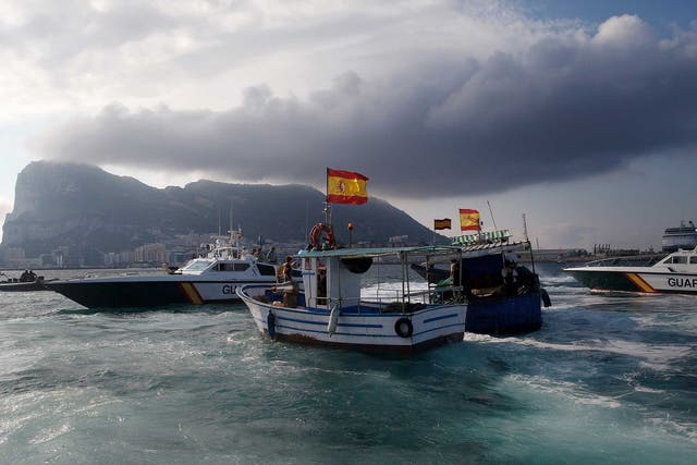 A Gibraltar police boat, Spanish Guardia Civil boat and Spanish fishing boats sail during a protest by Spanish fishermen in the sea near the Spain/Gibraltar border