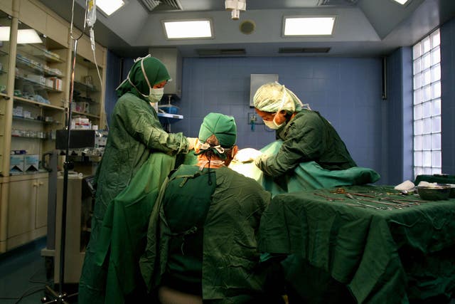 Doctors conduct a vagina surgery on a patient at a private clinic in Jakarta, 13 June 2007.