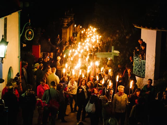 The torchlight procession that runs through the festival site each evening