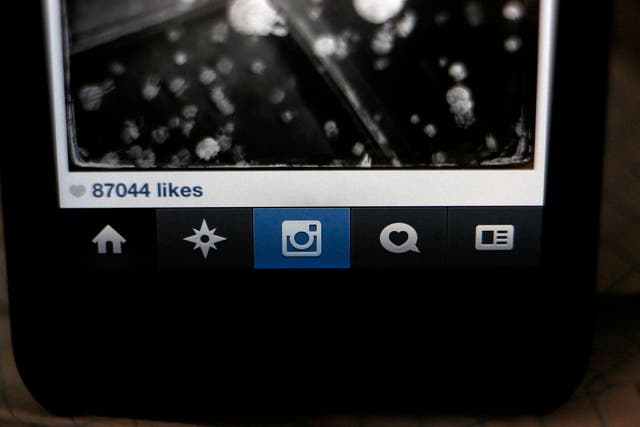 The number of likes on an Instagram photo are pictured on a mobile device screen in Pasadena, California August 14, 2013. 