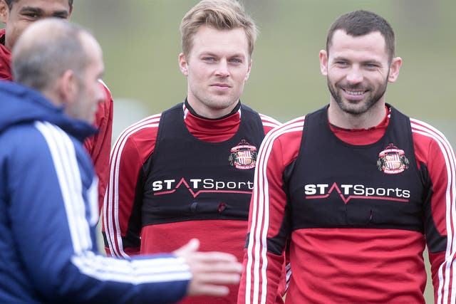 Phil Bardsley alongside Sebastian Larsson as they listen to Sunderland boss Paolo Di Canio