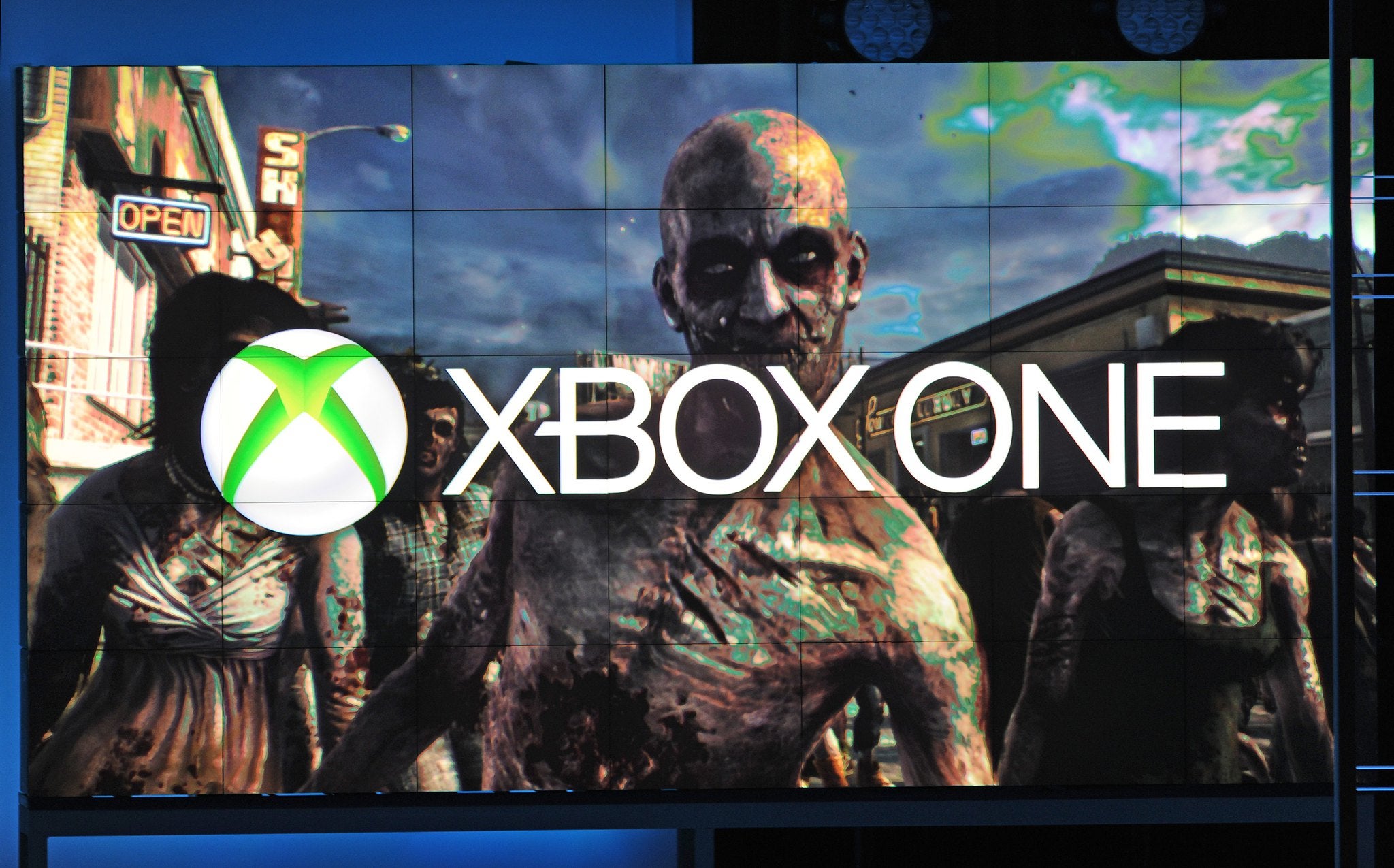 A frame from Dead Rising 3, exclusively for Xbox One, is seen under the Xbox One logo, at the Microsoft Xbox E3 2013 Media Briefing in Los Angeles on June 10, 2013. The press conference precedes the Electronic Entertainment Expo (E3) which takes place in
