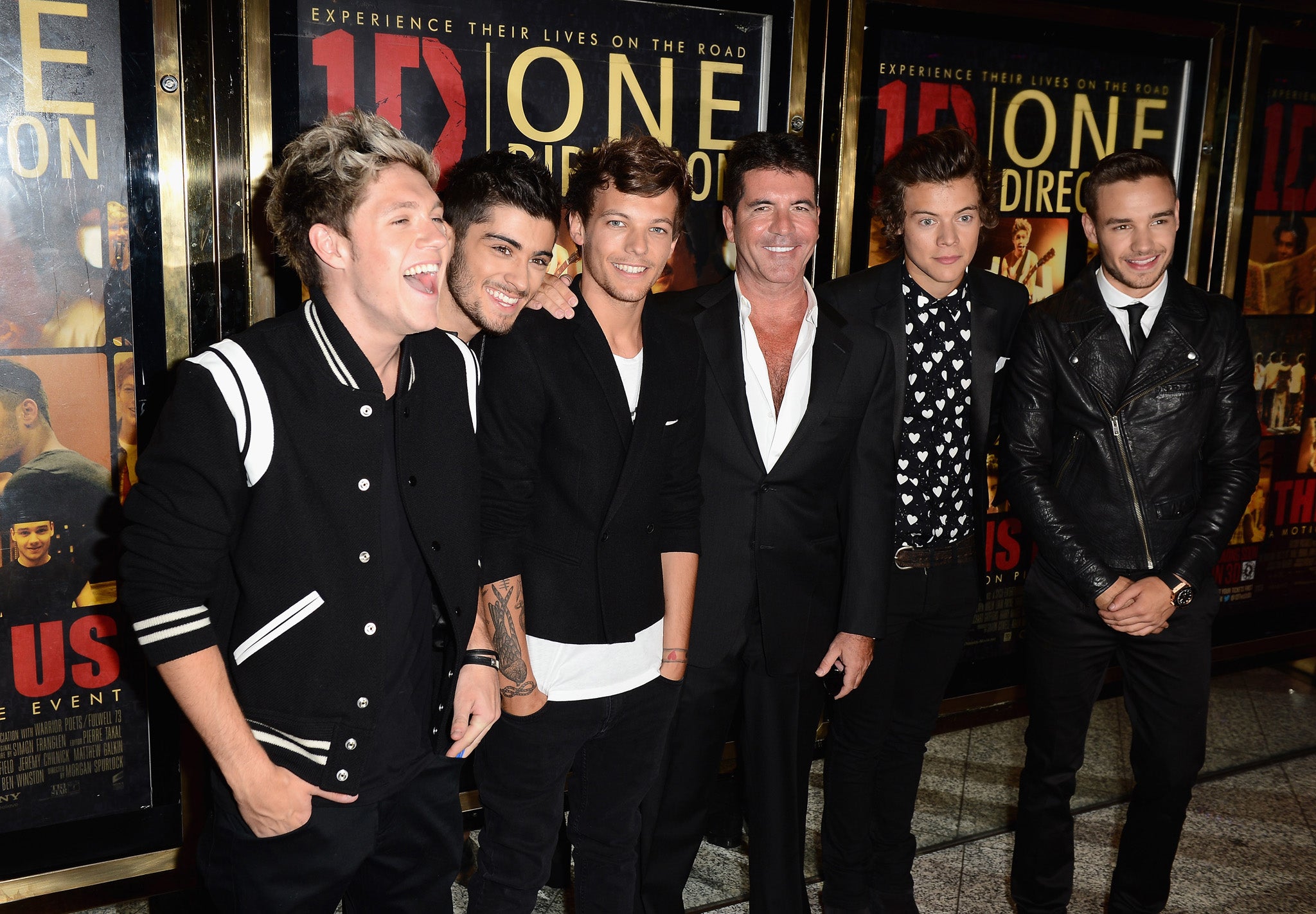 Simon Cowell (C) with Niall Horan, Zayn Malik, Louis Tomlinson, Harry Styles and Liam Payne from One Direction attend the 'One Direction This Is Us' world premiere