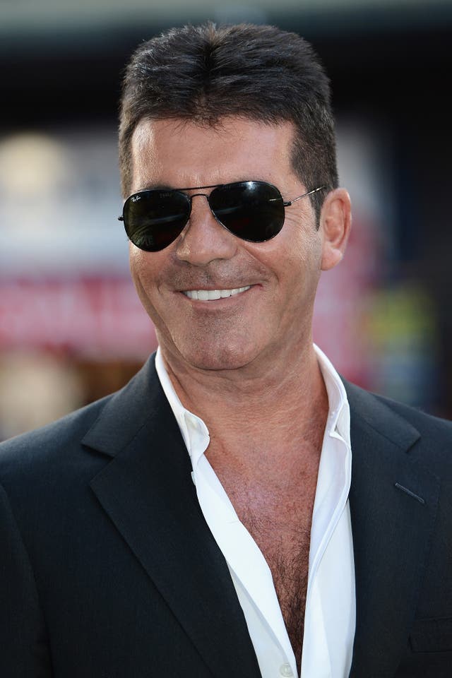 Simon Cowell says he is 'proud' to be becoming a father