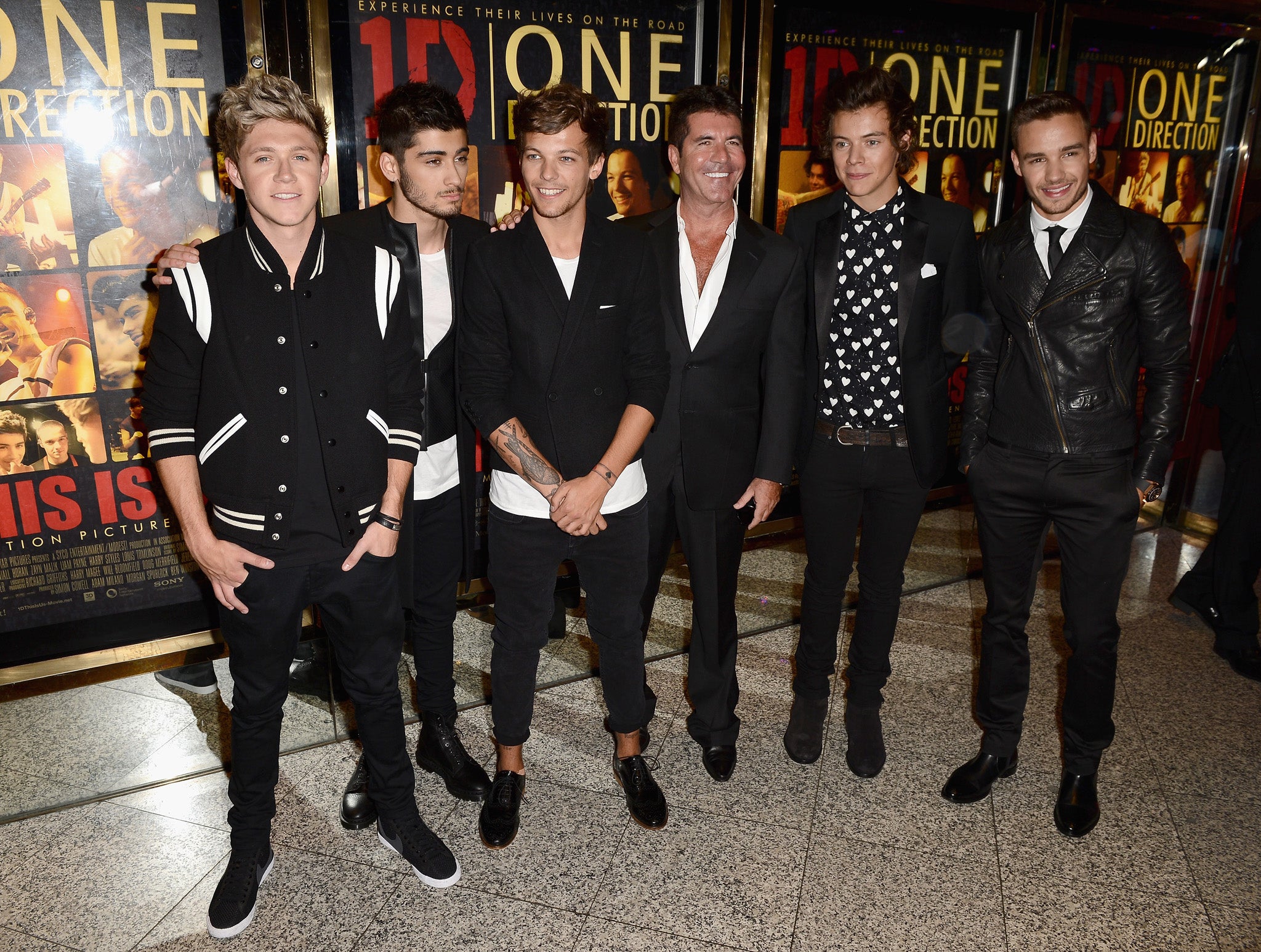 Simon Cowell (C) with (L-R) Niall Horan, Zayn Malik, Louis Tomlinson, Harry Styles and Liam Payne from One Direction attend the 'One Direction This Is Us' world premiere
