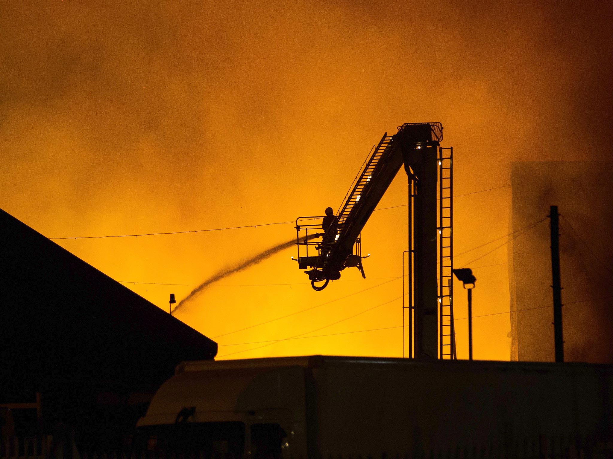 A fire crew tackles a blaze at Bredbury Recycling plant in Stockport