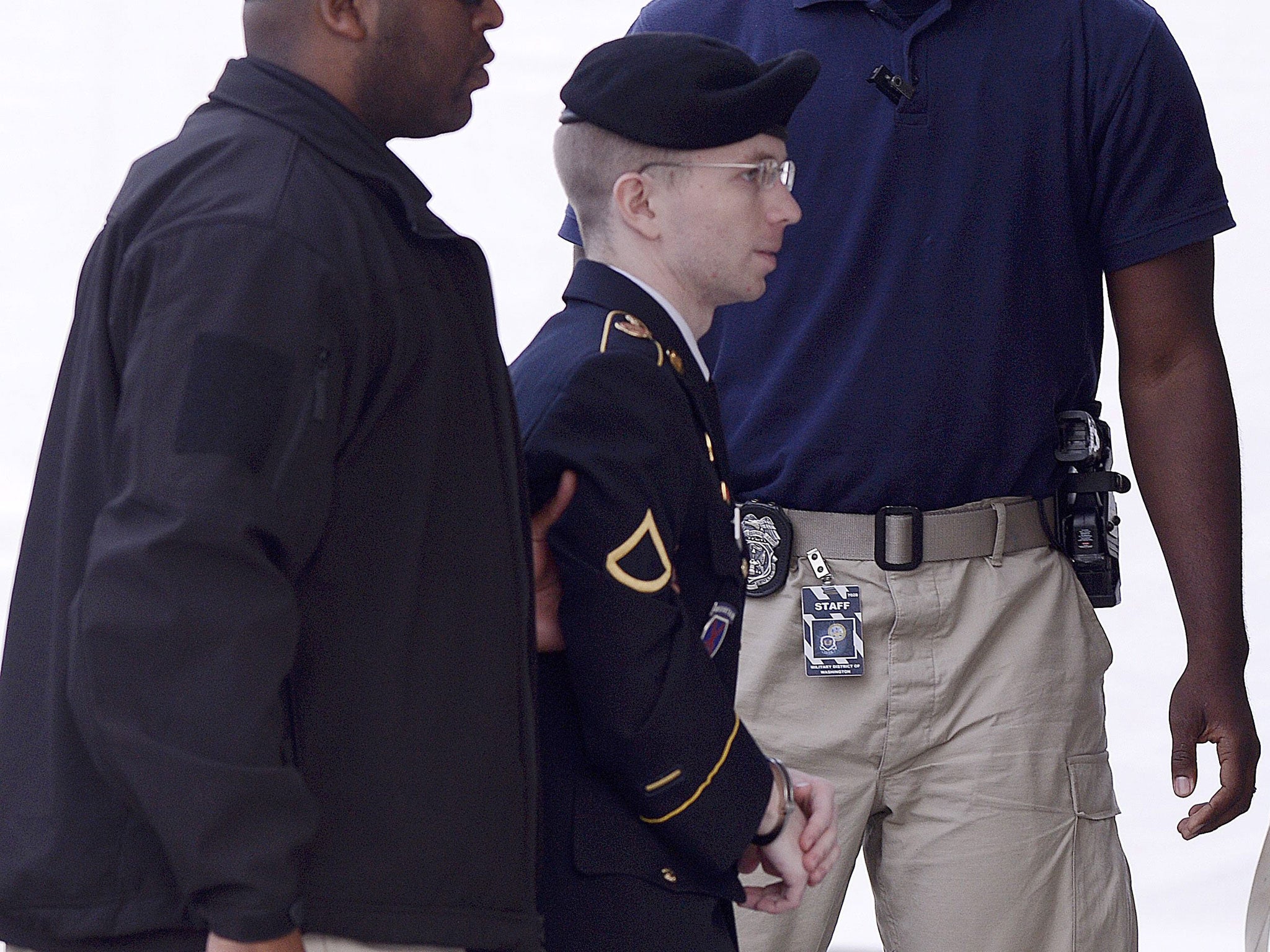 Bradley Manning is escorted into the courthouse during his trial