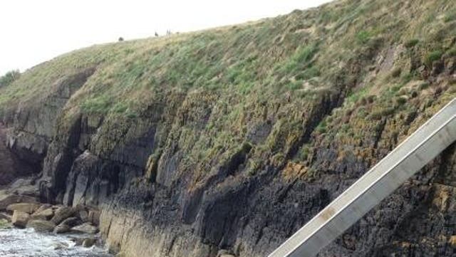 Bear Grylls tweeted this picture: "New slide attached at home on our island! You hit the water very fast!!!!"