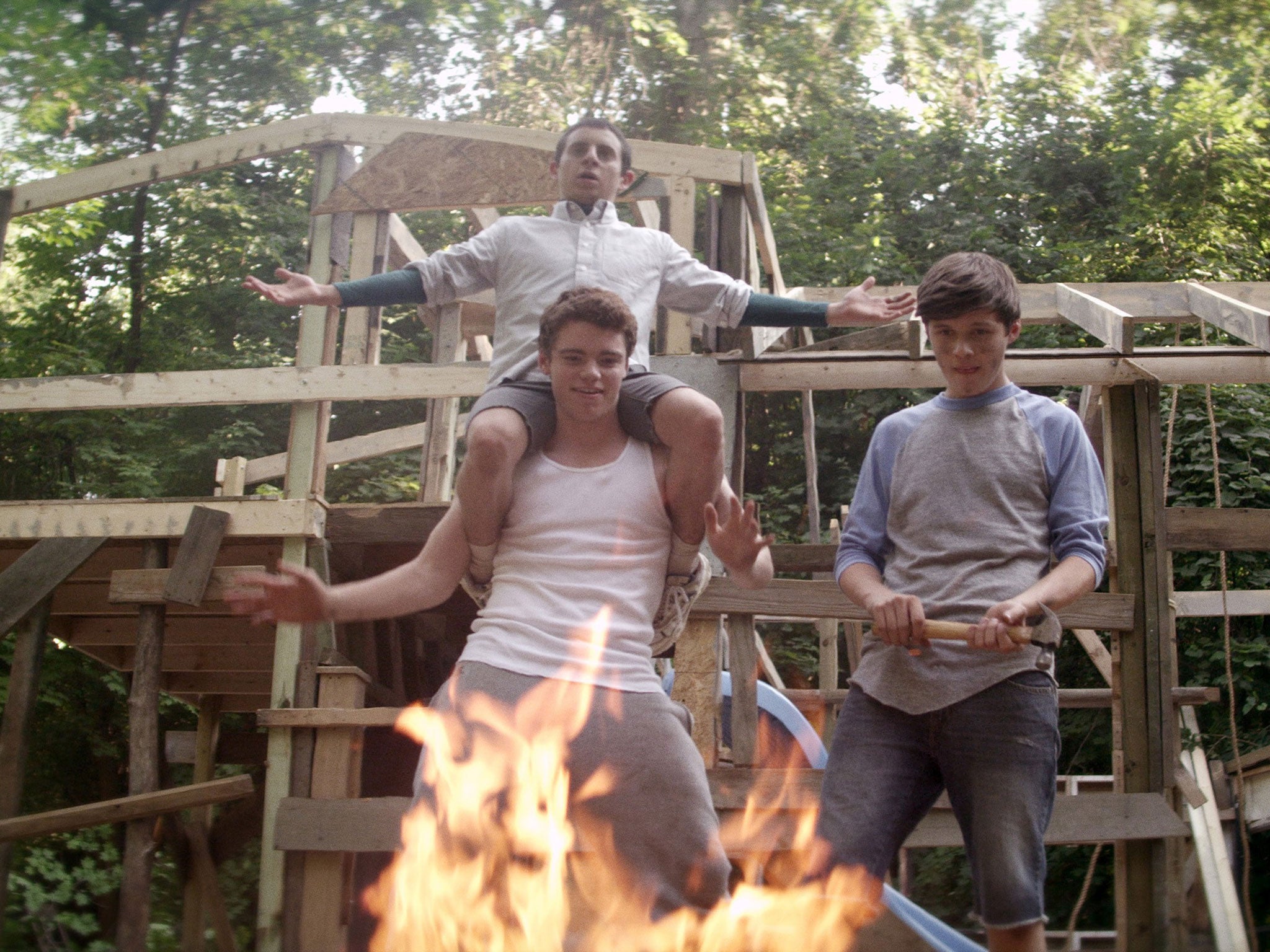 Hot stuff: Moises Arias on the shoulders of Gabriel Basso, with Nick Robinson, in the 'The Kings of Summer'