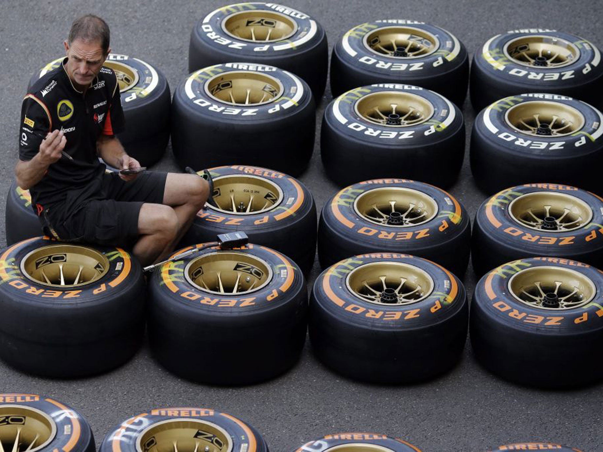 A Lotus mechanic checks tryes at the track yesterday ahead of this weekend’s Belgian Grand Prix