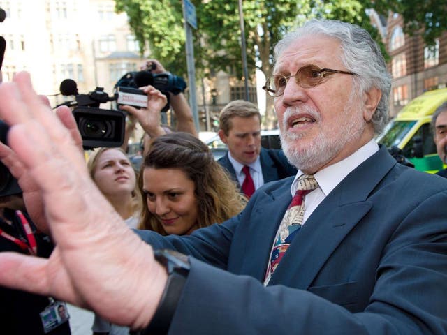 Former radio presenter Dave Lee Travis arrives at Westminster Magistrates Court in central London on 23 August 2013 to face charges of indecent and sexual assault
