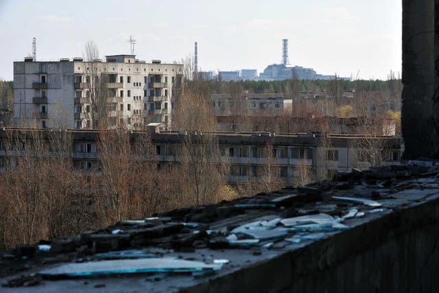 Decay of nature: the exploded reactor at the Chernobyl plant, seen from the ghost city of Pripyat