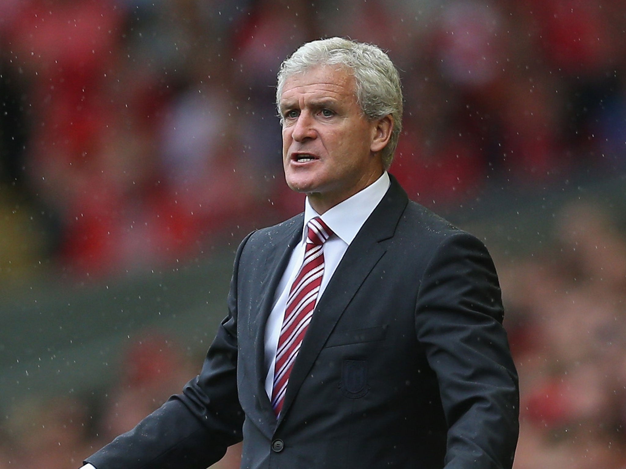 Stoke City, managed by Mark Hughes, take on Manchester City at the Britannia Stadium