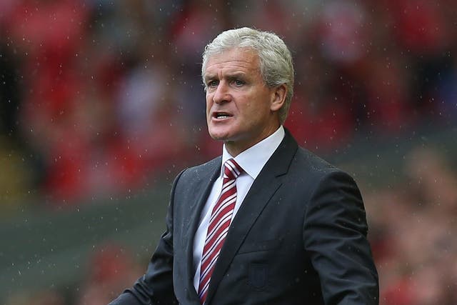 Stoke City, managed by Mark Hughes, take on Manchester City at the Britannia Stadium