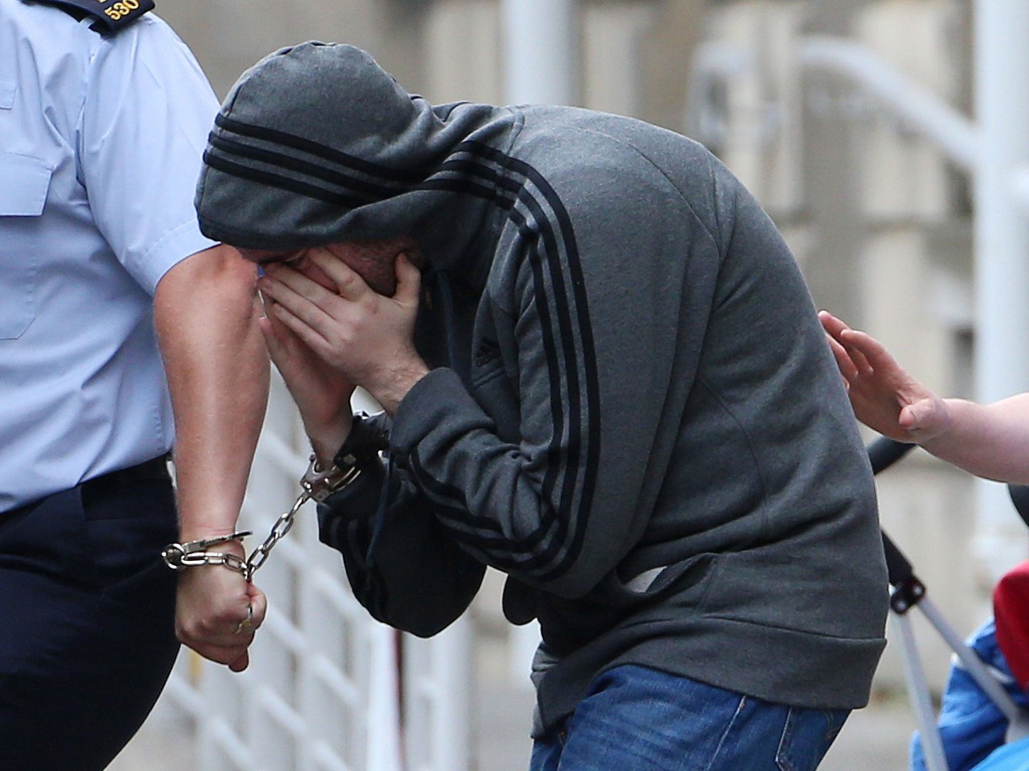 Eric Eoin Marques is led away from the High Court in Dublin after authorities in the United States have formally requested his extradition