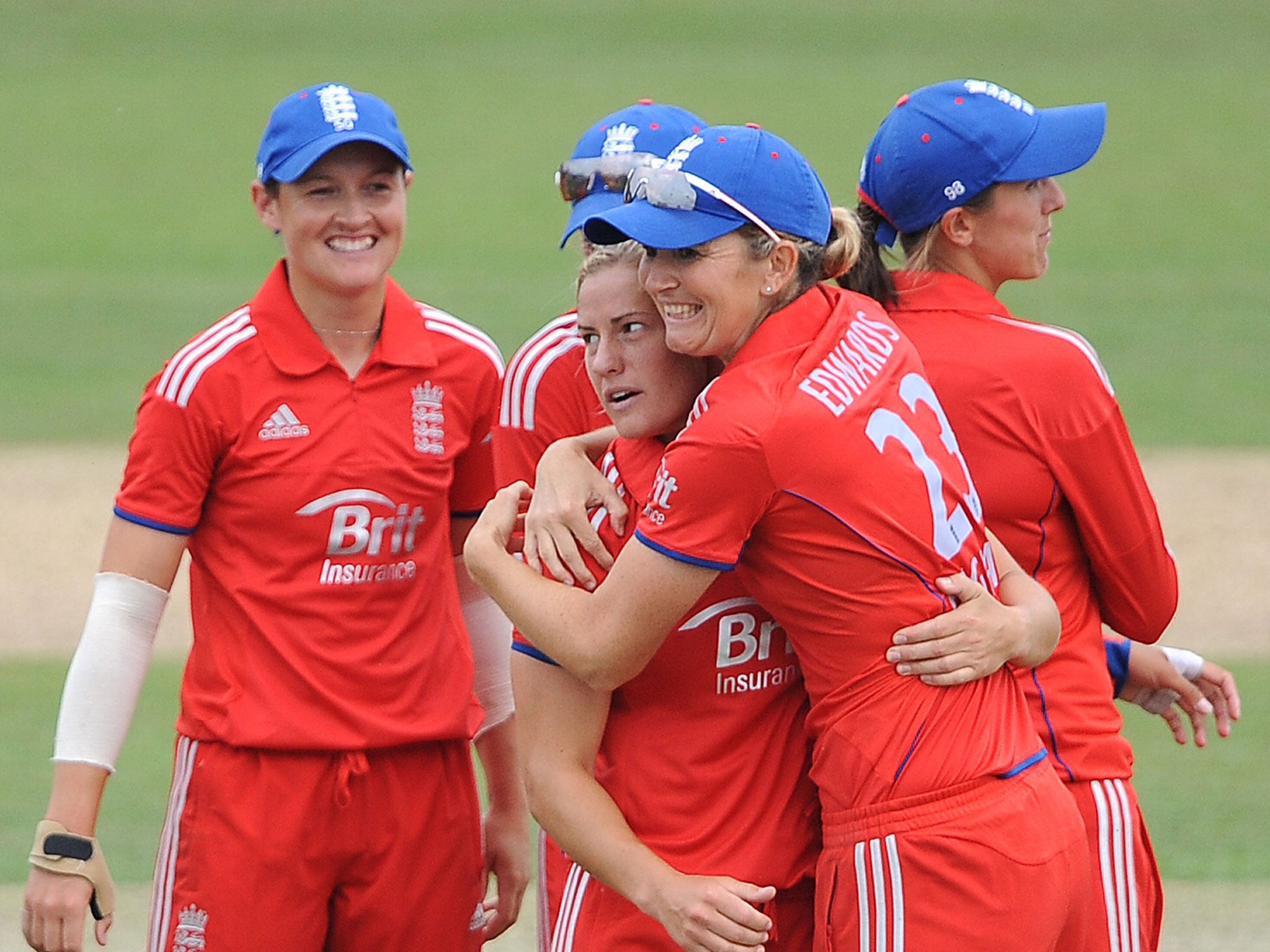 Katherine Brunt is hugged by Charlotte Edwards after taking the wicket of Jess Cameron