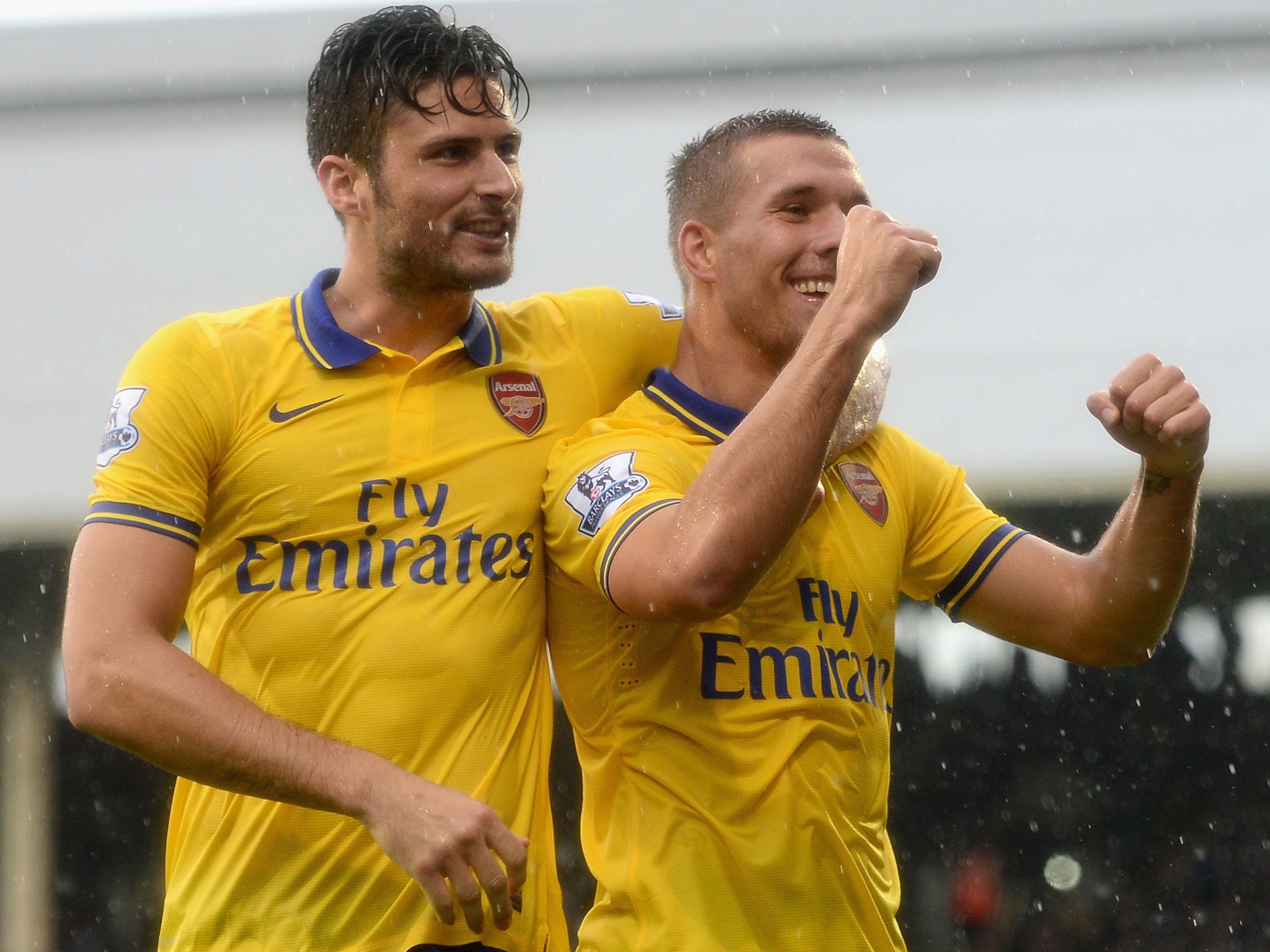 Lukas Podolski celebrates his second goal of the game with Olivier Giroud