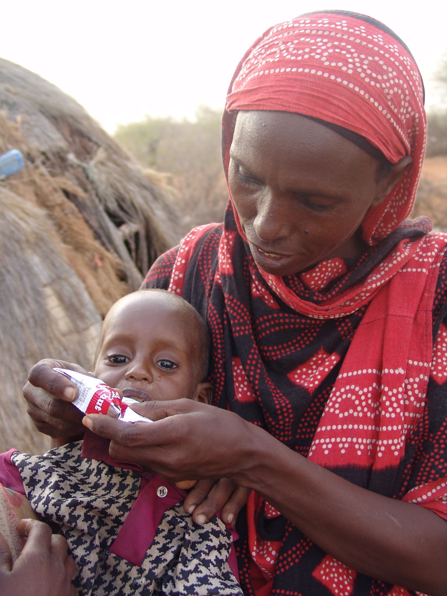 Unicef bought enough of the peanut-based paste (seen in use, above, and inset below) to feed two million children, a 15-fold increase over the past eight years