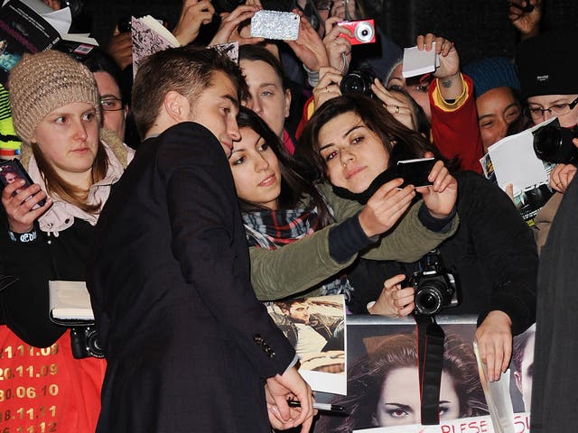 Robert Pattinson greets Twilight fans. But not always