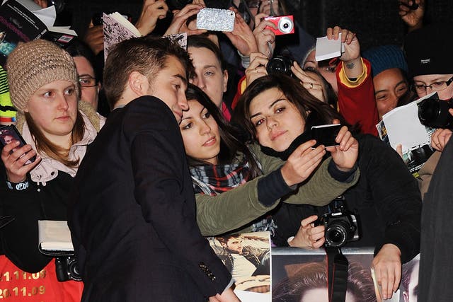 Robert Pattinson greets Twilight fans. But not always