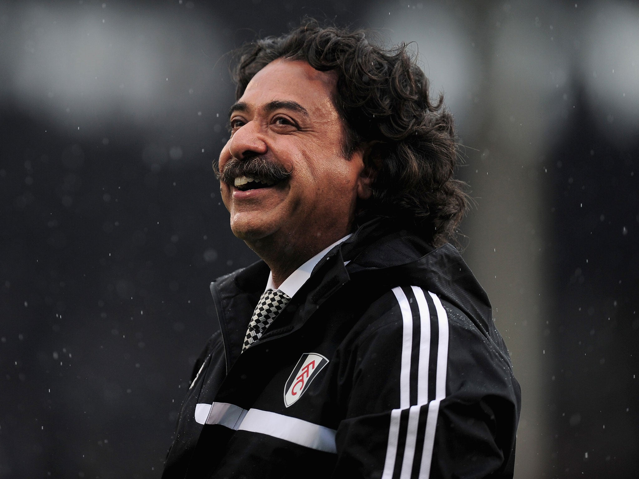 All smiles: Fulham owner Shahid Khan takes in his new surroundings