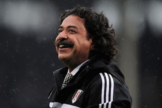 All smiles: Fulham owner Shahid Khan takes in his new surroundings