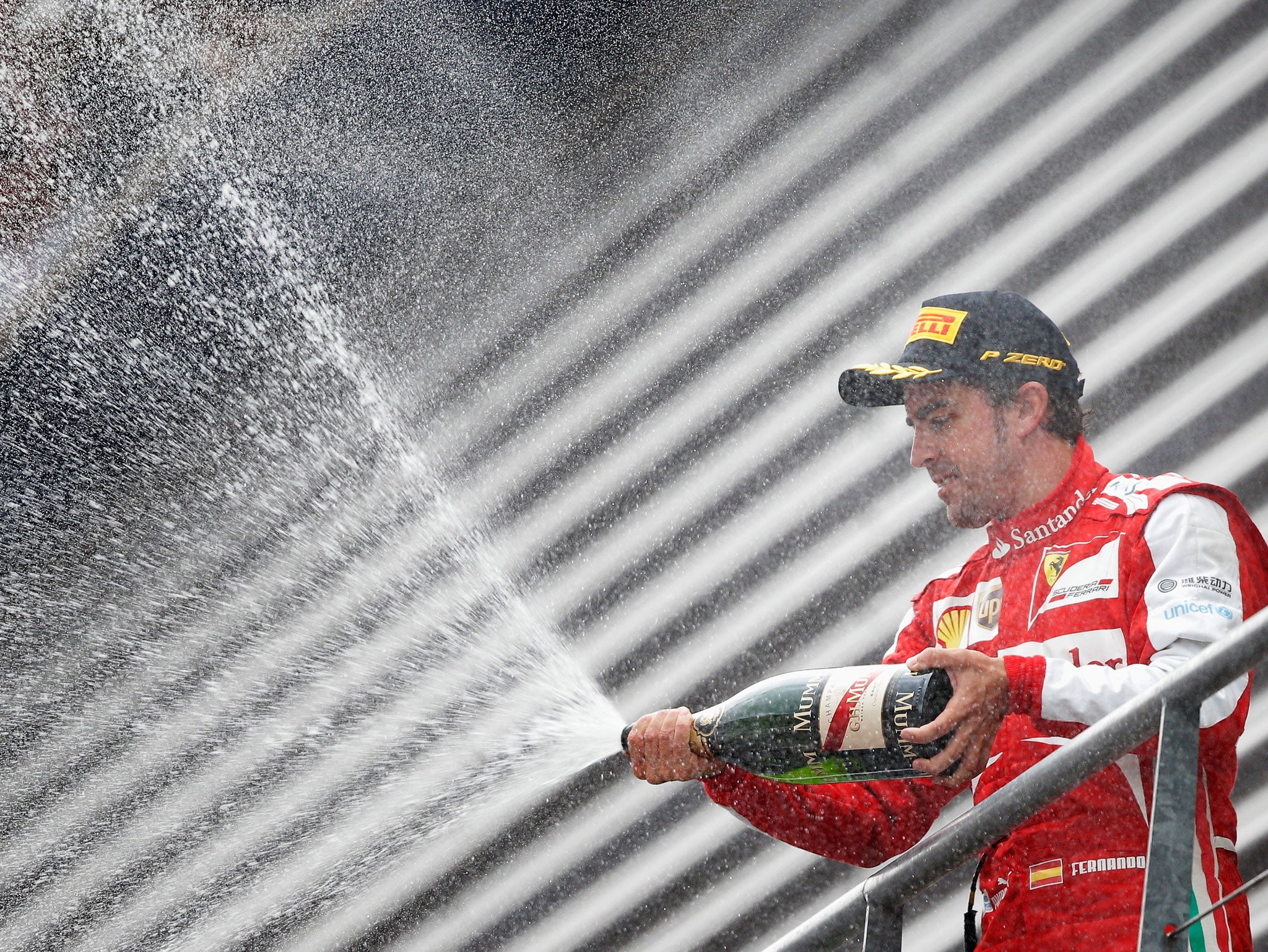 SPA, BELGIUM - AUGUST 25: Fernando Alonso of Spain and Ferrari celebrates finishing second during the Belgian Grand Prix at Circuit de Spa-Francorchamps on August 25, 2013 in Spa, Belgium. GETTY IMAGES