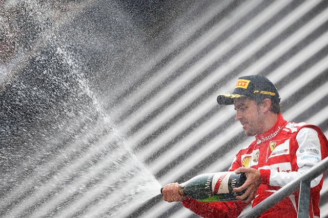 SPA, BELGIUM - AUGUST 25: Fernando Alonso of Spain and Ferrari celebrates finishing second during the Belgian Grand Prix at Circuit de Spa-Francorchamps on August 25, 2013 in Spa, Belgium. GETTY IMAGES